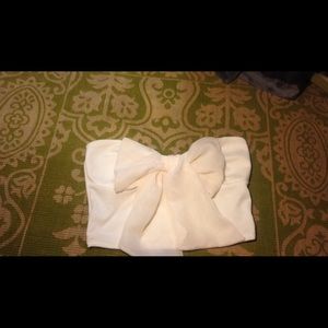 White crop top with a sheer bow in the front