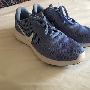 Light blue Nike running shoes