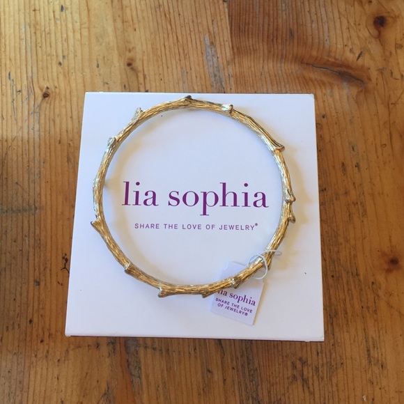 Gold bangle bracelet. Lia Sophia out on a limb.