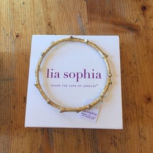 Gold bangle bracelet. Lia Sophia out on a limb.