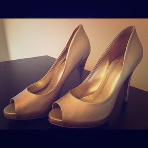 BCBG gold pumps