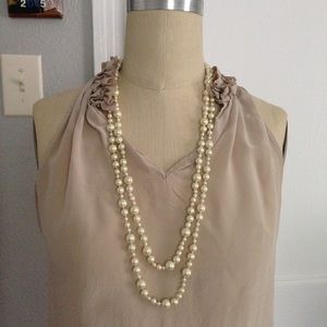 Two strands of J.Crew pearl necklaces.