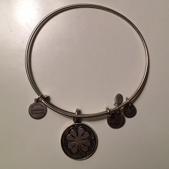 A silver four leaf clover Alex and Ani bracelet