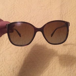 Brown Prada sunglasses.