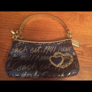 Navy blue and gold coach handbag