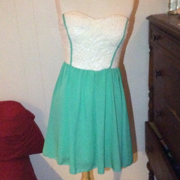 White lace and teal strapless dress