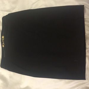Black pencil skirt with gold buckle