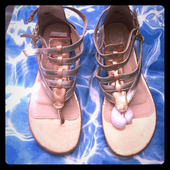 Three buckled sandals
