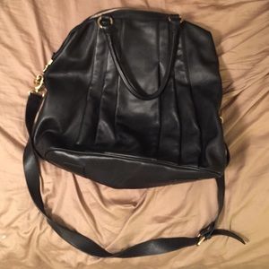 Black and tan vegan leather bag.