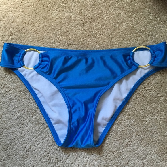 Blue bathing suit bottoms with gold rings