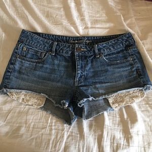 American Eagle jean shorts with lace pockets