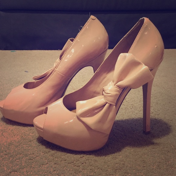 Cream with a hint of pastel pink colored heels.