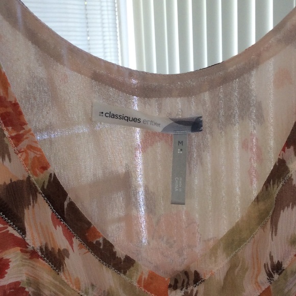 A sleeveless somewhat dressy tank style top. - Picture 2 of 3