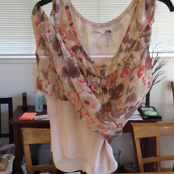 A sleeveless somewhat dressy tank style top. - Picture 3 of 3