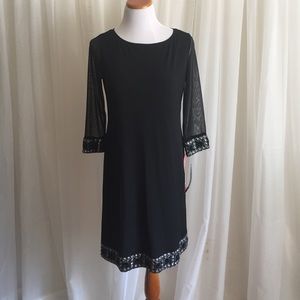 Beautiful black dress w/ sheer sleeves and accents