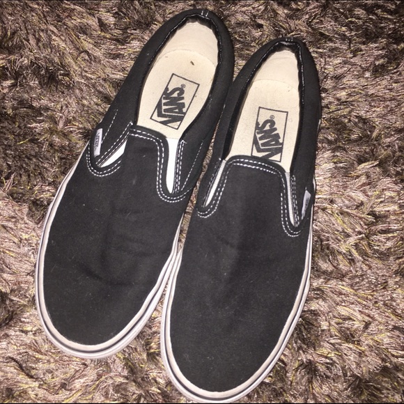 Black and white slip on vans