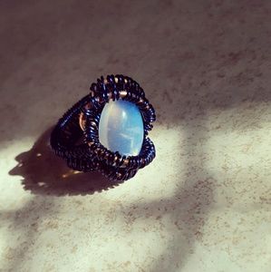 Wire wrapping rainbow opal ring