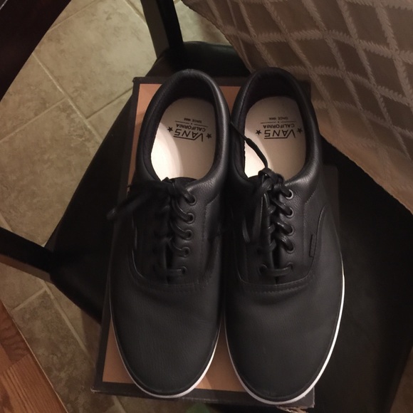 Men's black leather vans.