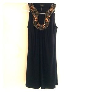 Black dress with gold beads by shelli Segal.