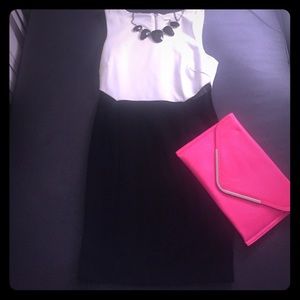 Black and white dress with side mesh inserts.