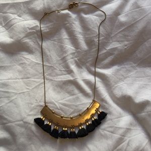 Gold necklace with tassel detail