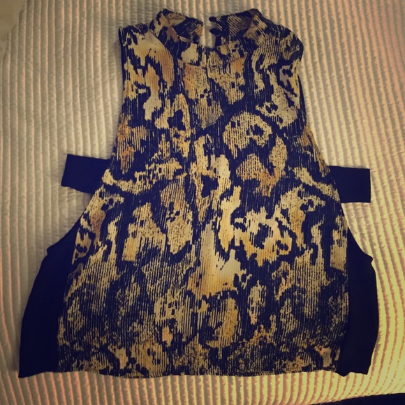 Fun and flirty top with cut out sides.