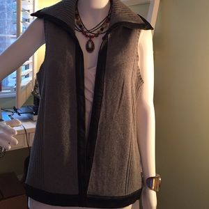 Grey sweater vest with faux leather trim