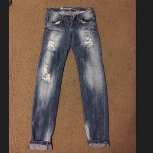 Distressed denim jeans