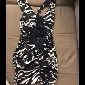 Zebra print rushed tank top with lace front.