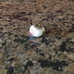 Pink flower on white bead