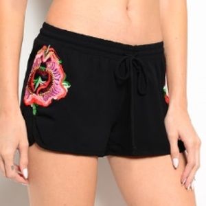 Black runner style shorts.
