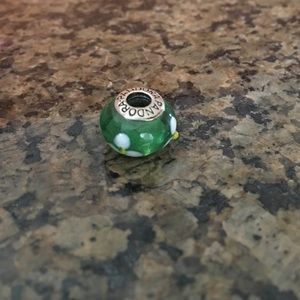 White and yellow flower on green bead