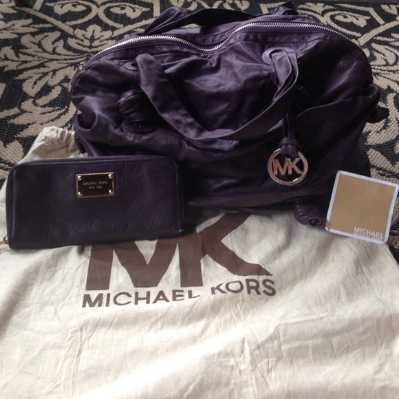 Authentic Michael Kors bag with matching wallet.