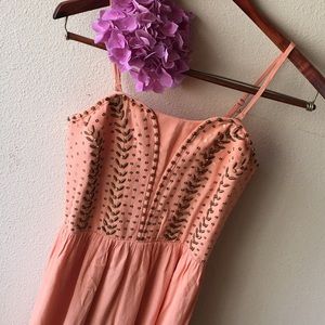 Peach color romper with studs