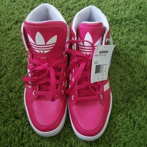 Shocking pink adidas sneakers