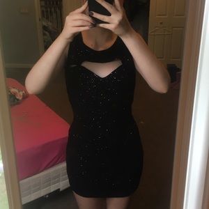 Short black sequined dress, cut out back