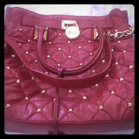 MK gold stuffed red purse