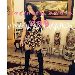 Over knee high pant/pantyhose of a bear tattoo