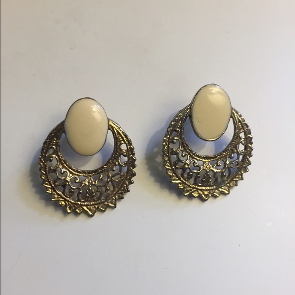 Gold, white statement stud earrings