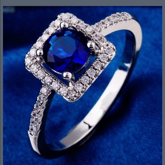 Stunning white gold plated blue center stone ring