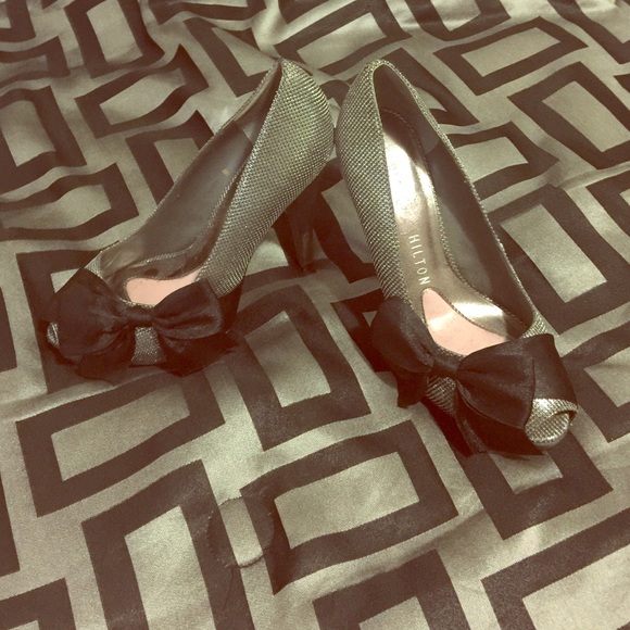 Silver Paris Hilton heels with black bow