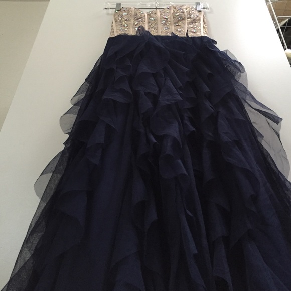 A beaded corset top with a navy bottom - Picture 2 of 2