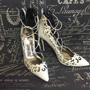 White laser cut lace up heels