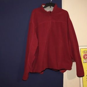 Plus sized sweater with pockets and a zipper.