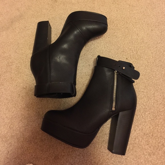 Black high heel boots with buckle and zipper