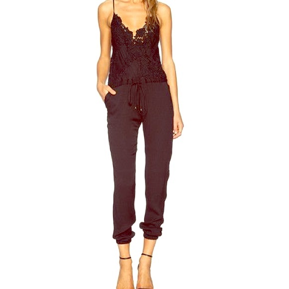 NEW jumpsuit size small. Black with lace top