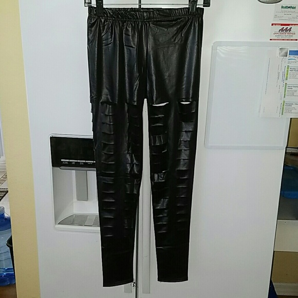 Black ripped slotted across fake leather leggings