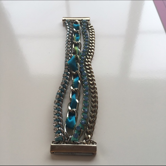 Multi strand magnetic closure teal tone bracelet