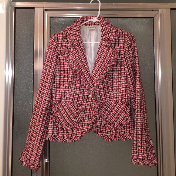 Red, black and white multi colored jacket.