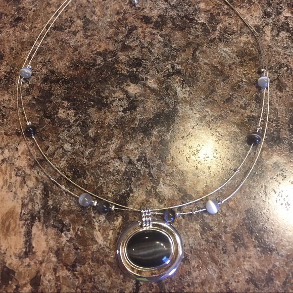 Silver New York and company necklace.